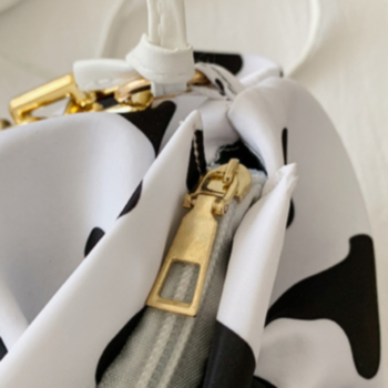 Fashion metal chain dairy cow printing pleating zip-up PU handbag